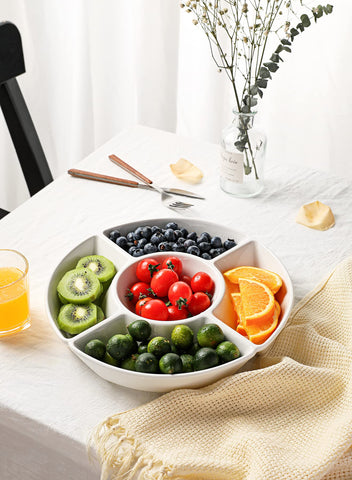 Close-up of central condiment holder with bowls on the tray