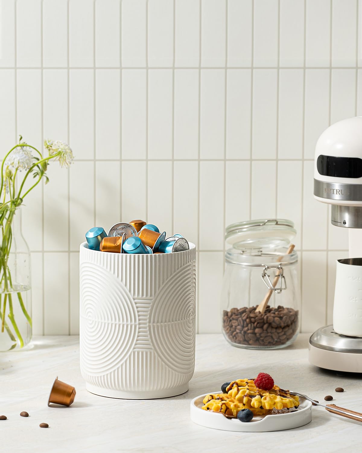 Swicken white ceramic utensil holder design blends with many kitchen styles.