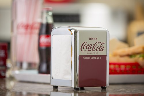 Tablecraft Coca-Cola napkin dispenser side view showing compact half-size design