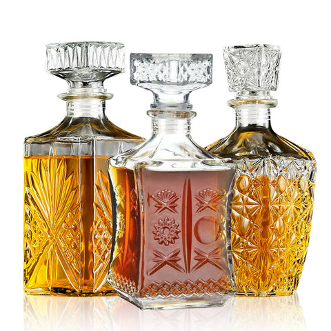TAEYONK whiskey decanter set in three styles displayed on a bar
