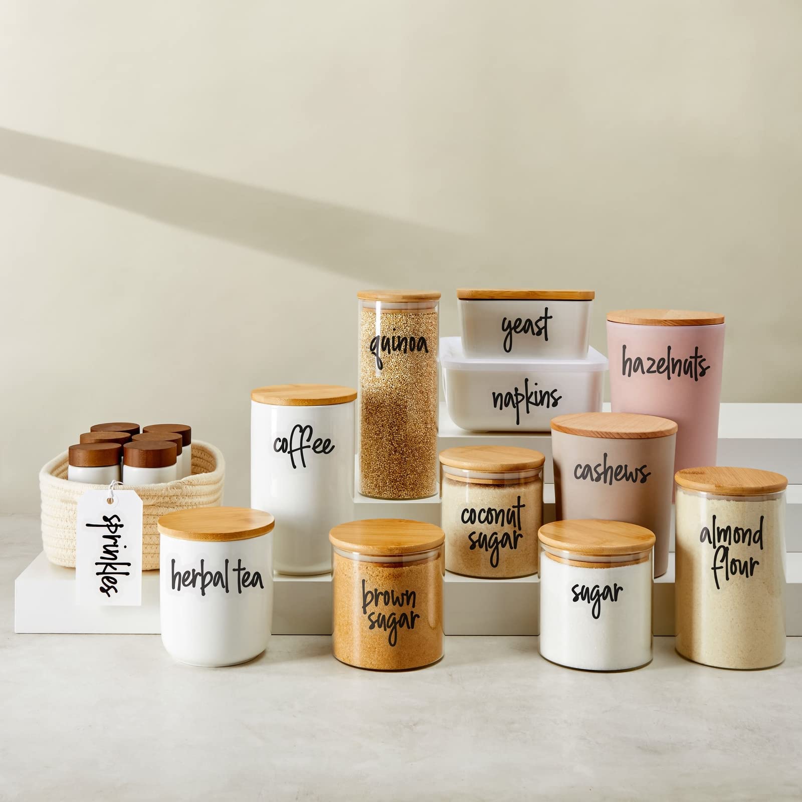 Clear background with black script adds elegance to kitchen storage.