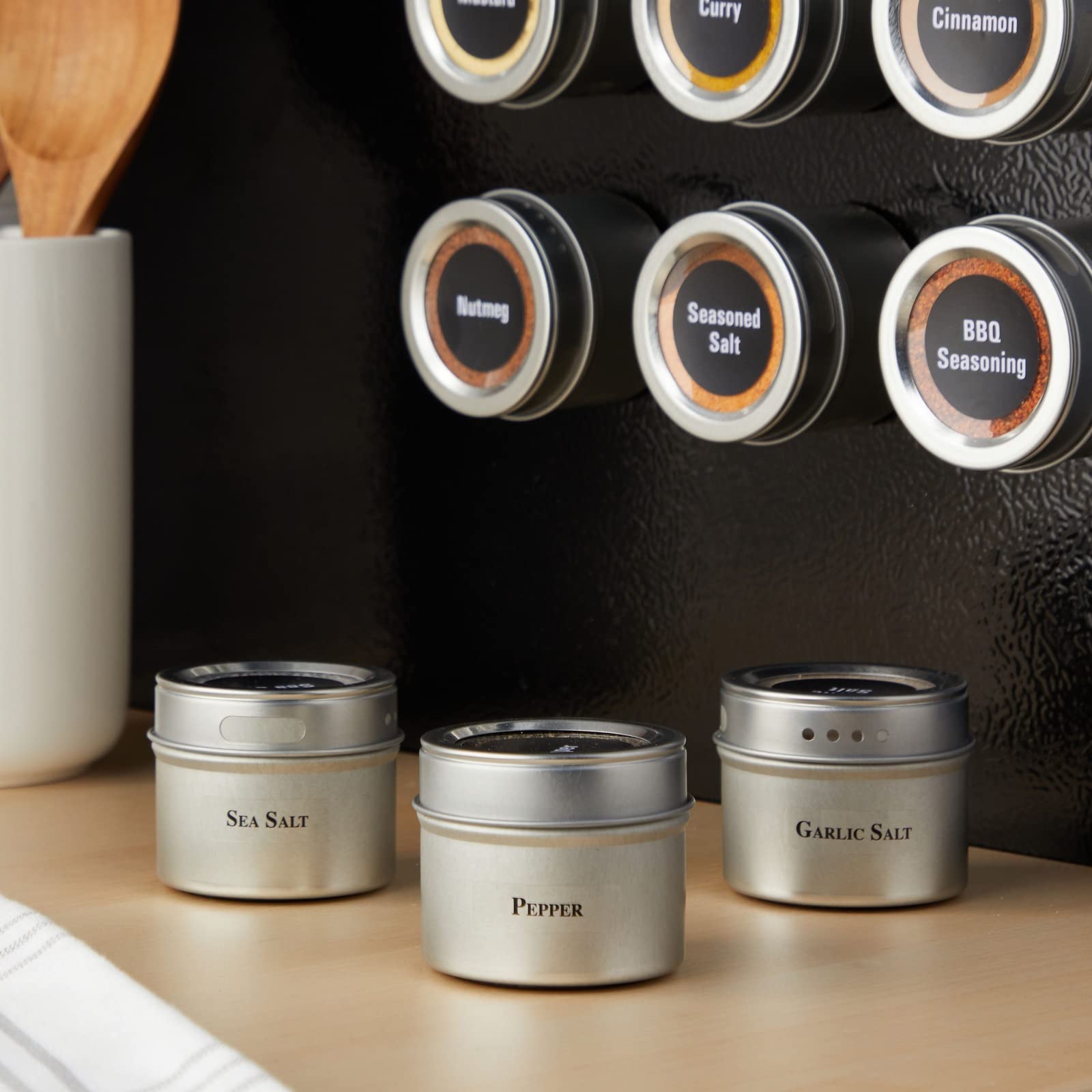 Talented Kitchen sift-pour lids shown for precise seasoning control.