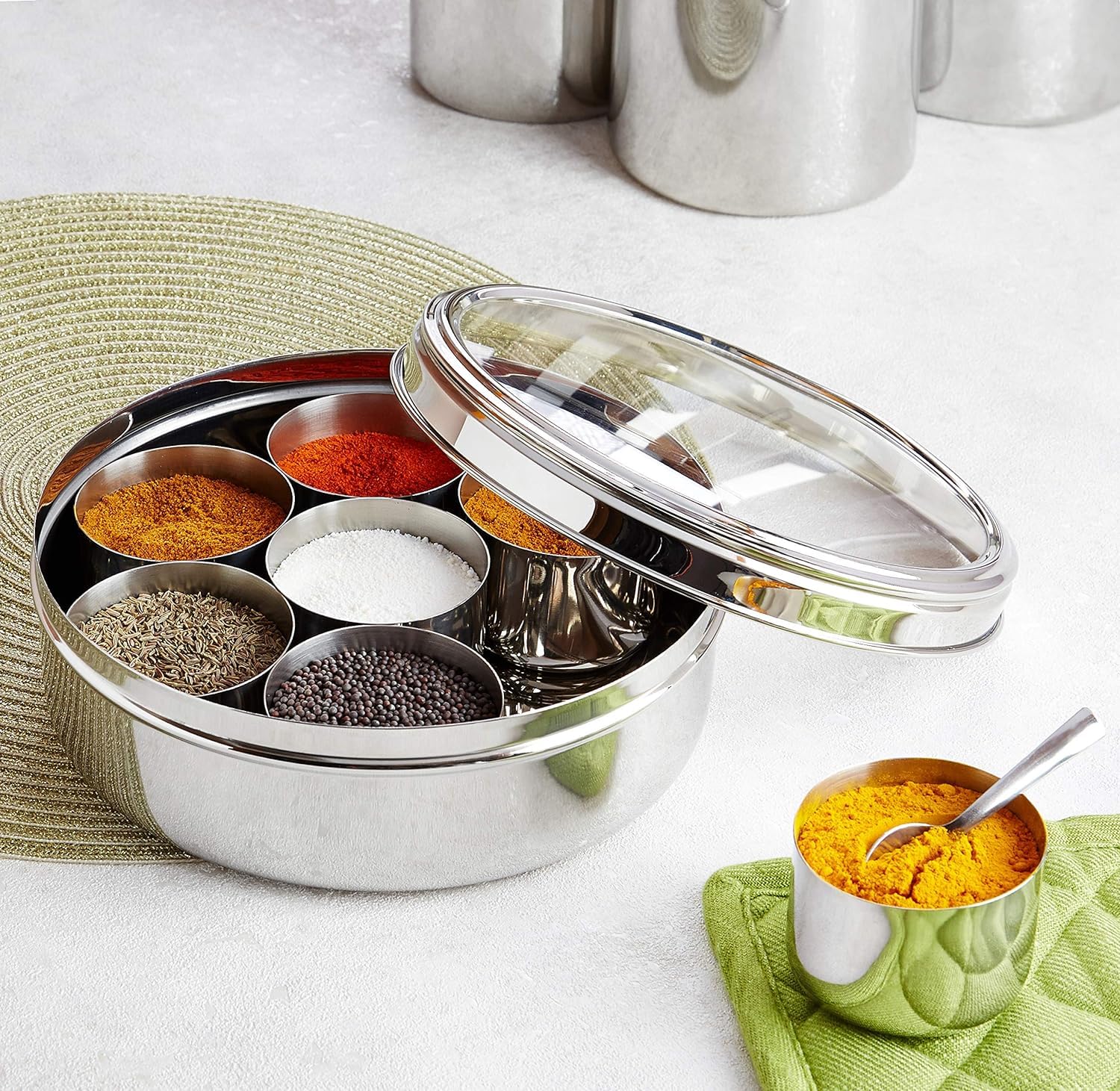 Taluka stainless steel spice container offers durable, nonreactive storage for spices.