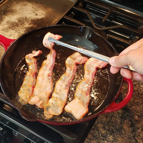 Tangoowal 12-inch tweezers used during stir-fry for controlled movement