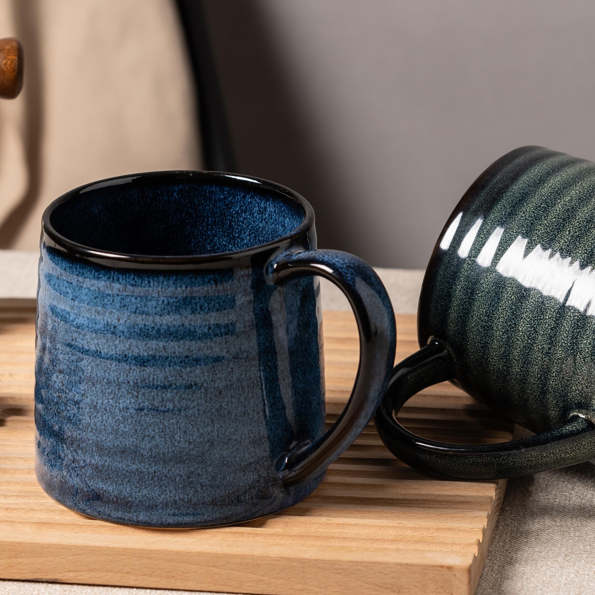 TaoTaojarvie blue stripe-pattern mug adds visual flair to any table.