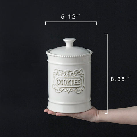 TAWCHES cookie jar lid on kitchen counter showcases vintage style and easy sealing.