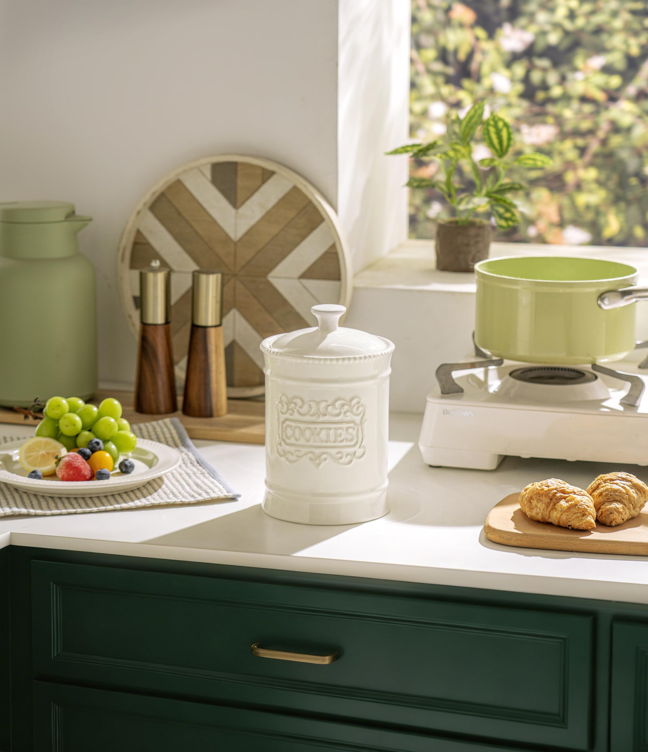 TAWCHES vintage ceramic cookie canister adds decorative charm while organizing cookies.