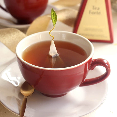 Tea Forte Cafe Cup Ruby Red with steeping hole lid for easy infuser access.