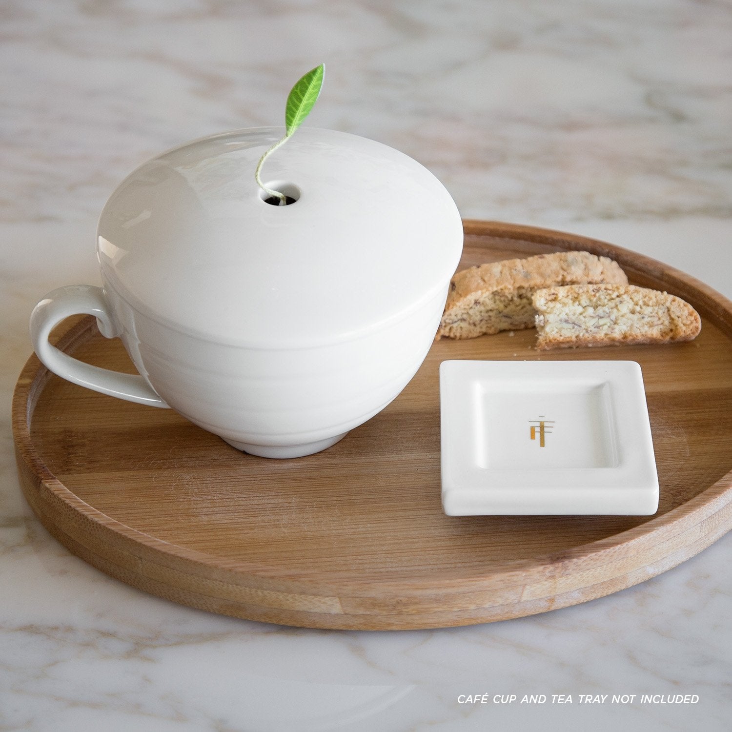 Tea Forte bamboo tray close-up, compact oval design ideal for daily tea breaks.