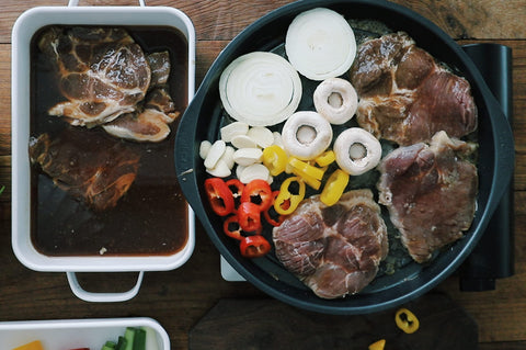 TECHEF KBBQ grill pan swirled channel design drains fat while cooking.