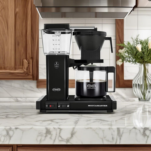 Technivorm Moccamaster KBGV 10-Cup carafe pouring with a steady pour.