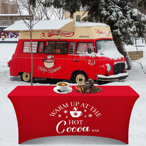 Tegeme stall setup with red tablecloth creates inviting holiday ambiance.