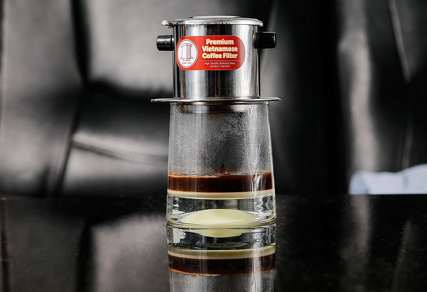 Thang Long Vietnamese coffee filter set with 4 pieces and sturdy handles for everyday brewing.
