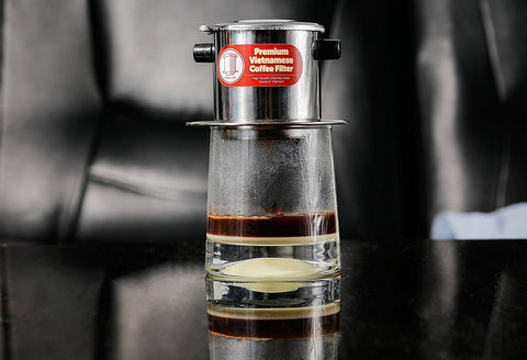 Thang Long Vietnamese coffee filter set with 4 pieces and sturdy handles for everyday brewing.