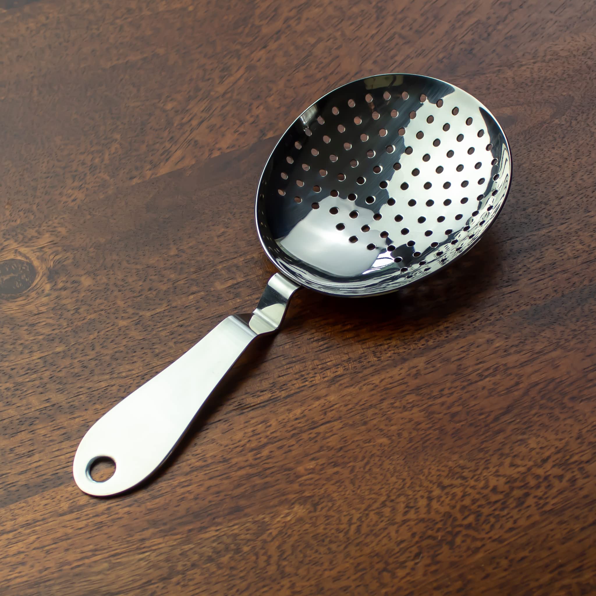 The Art of Craft Julep Strainer shown for one-handed operation for fast pours
