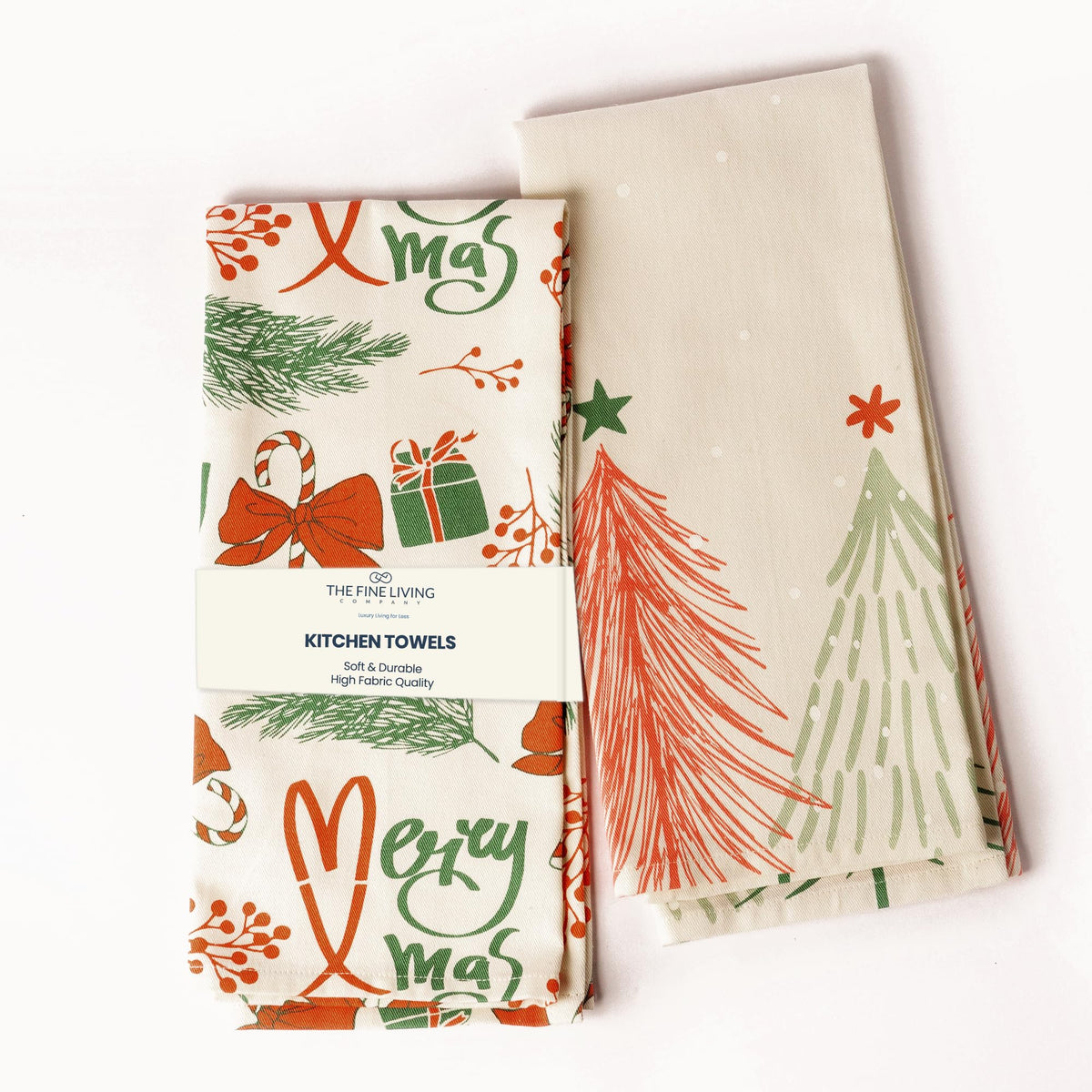 The Fine Living Co Merry Christmas towels folded in cherry red for festive kitchen prep.