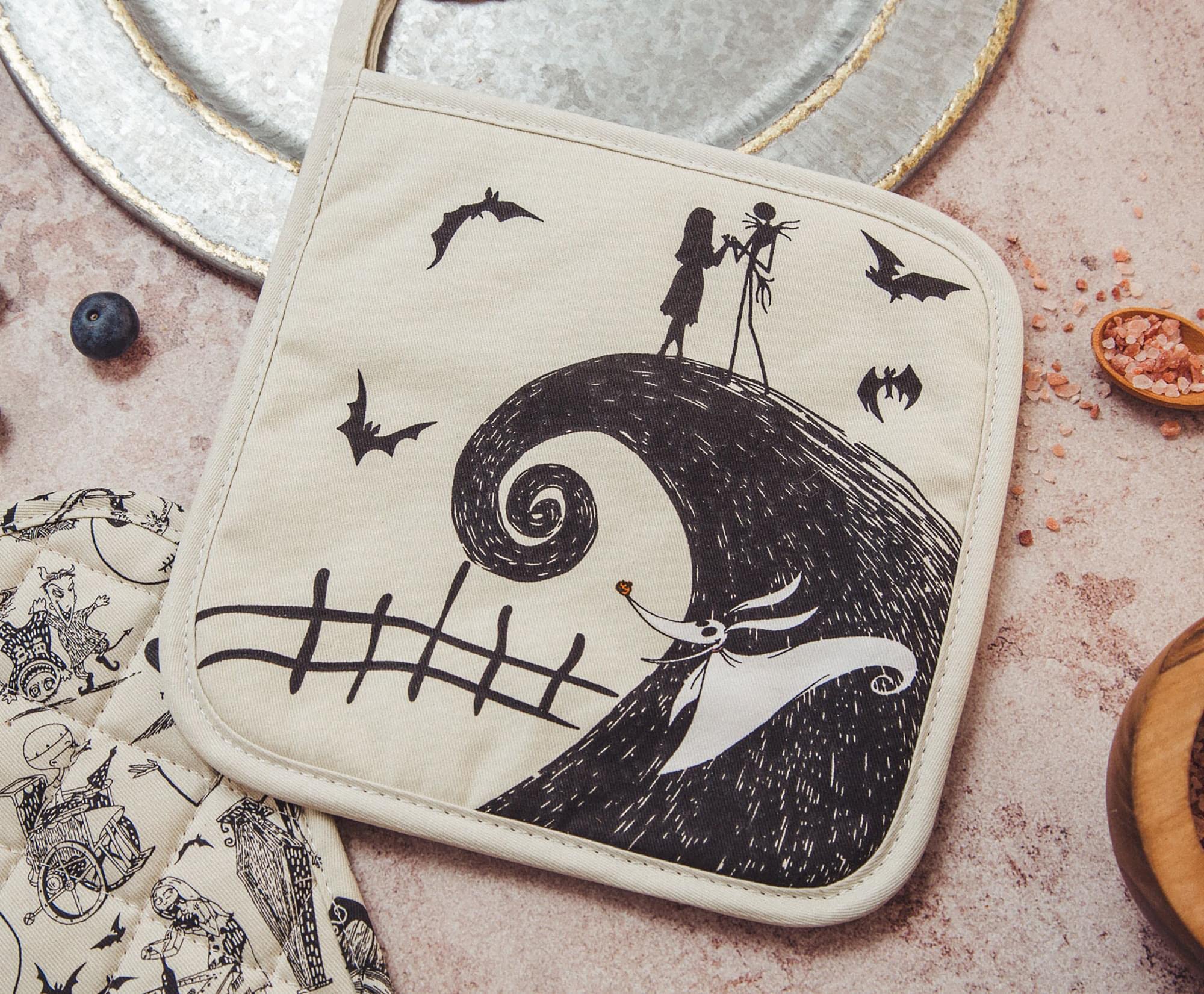 Zero the ghost dog playing in the foreground with Nightmare pot holders