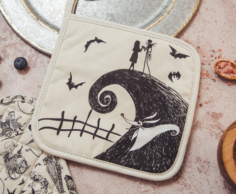 Zero the ghost dog playing in the foreground with Nightmare pot holders