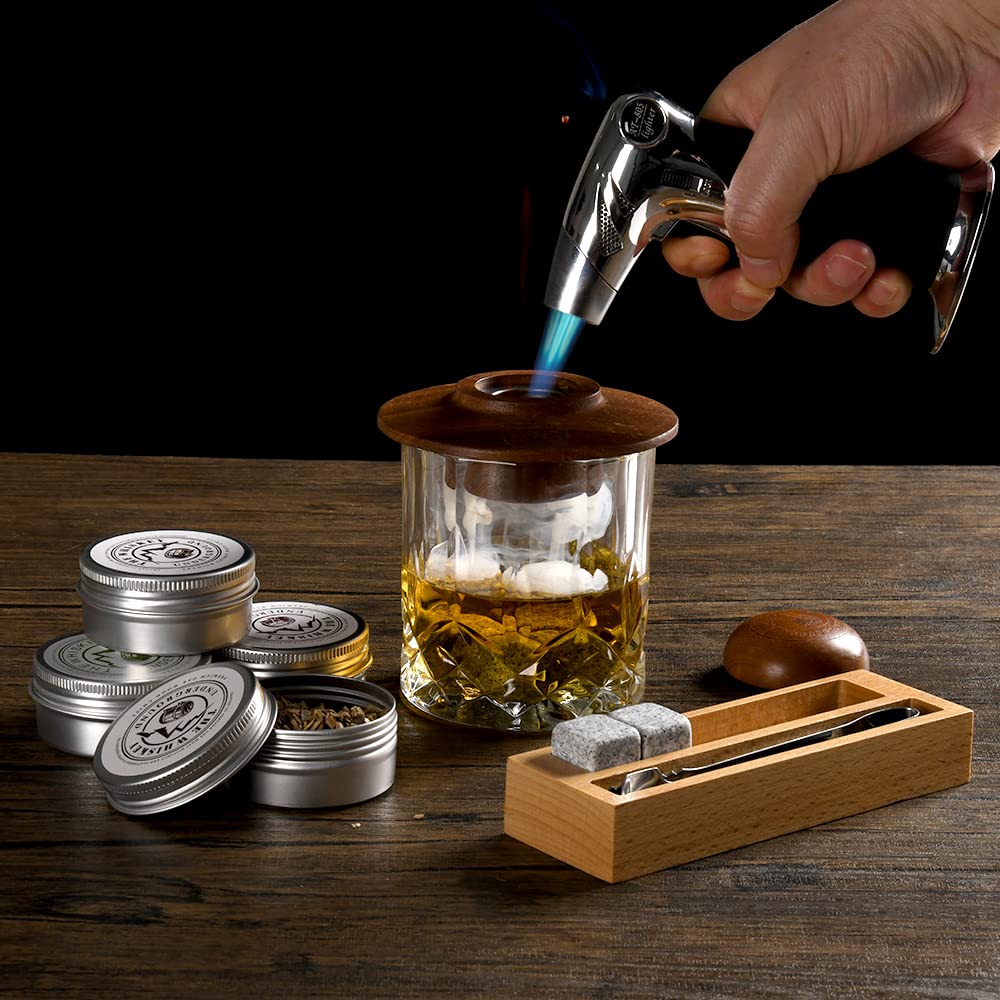 The Whiskey Underground hand torch in use for precise cocktail smoking.