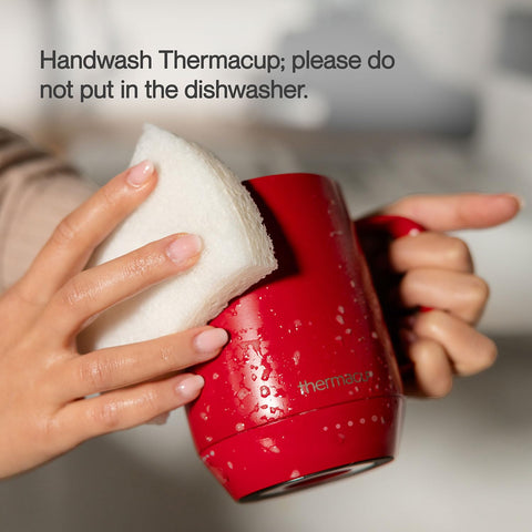 THERMACUP 14oz capacity mug with spill-proof lid on a work surface.