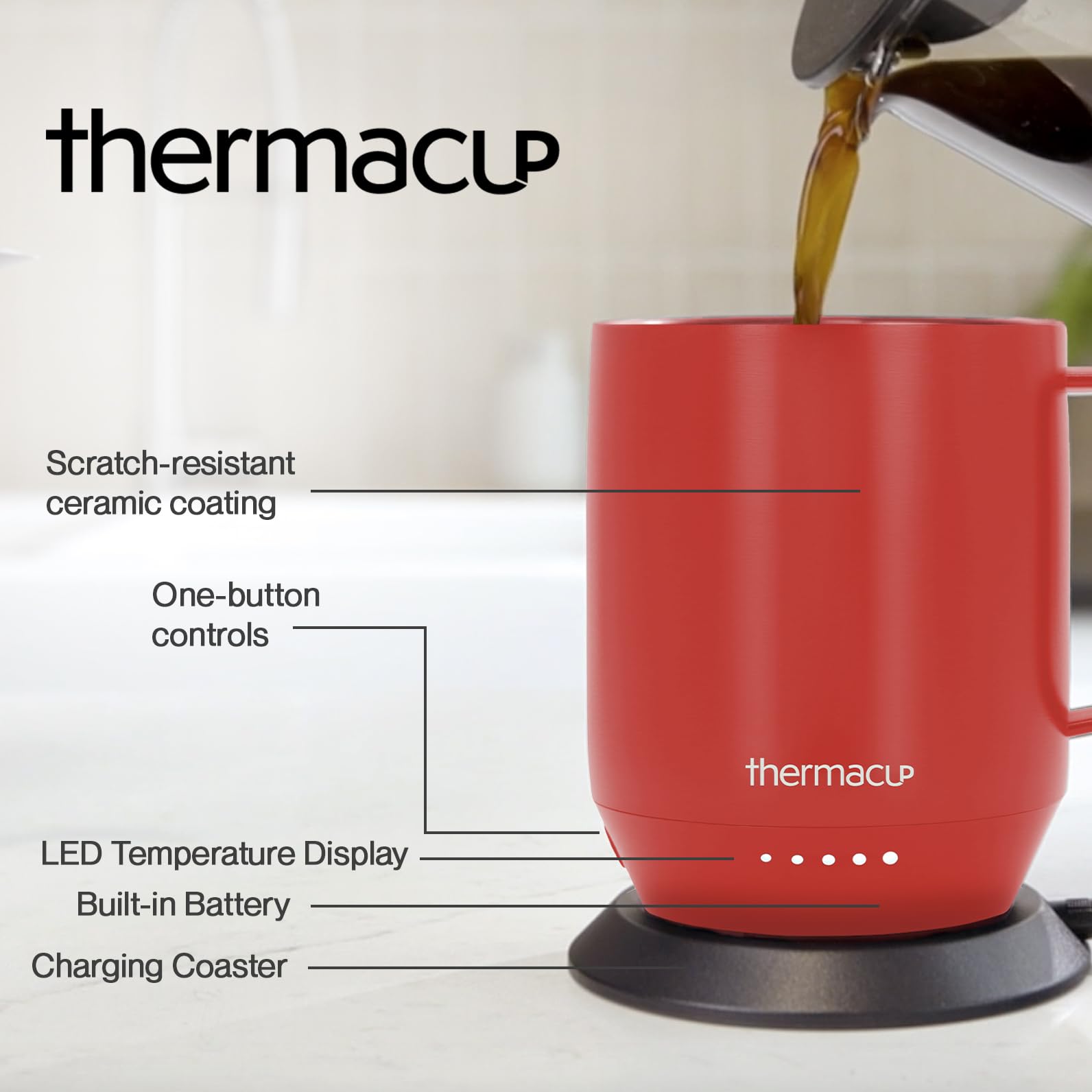 THERMACUP ergonomic stainless steel mug with comfortable handle in use at a desk.