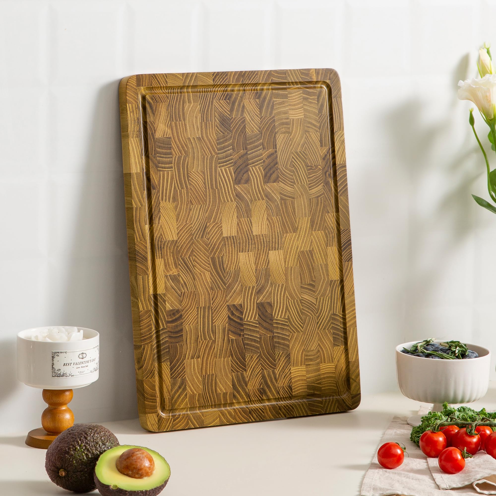 thetchry teak charcuterie board doubles as a stylish serving tray for cheese and vegetables.