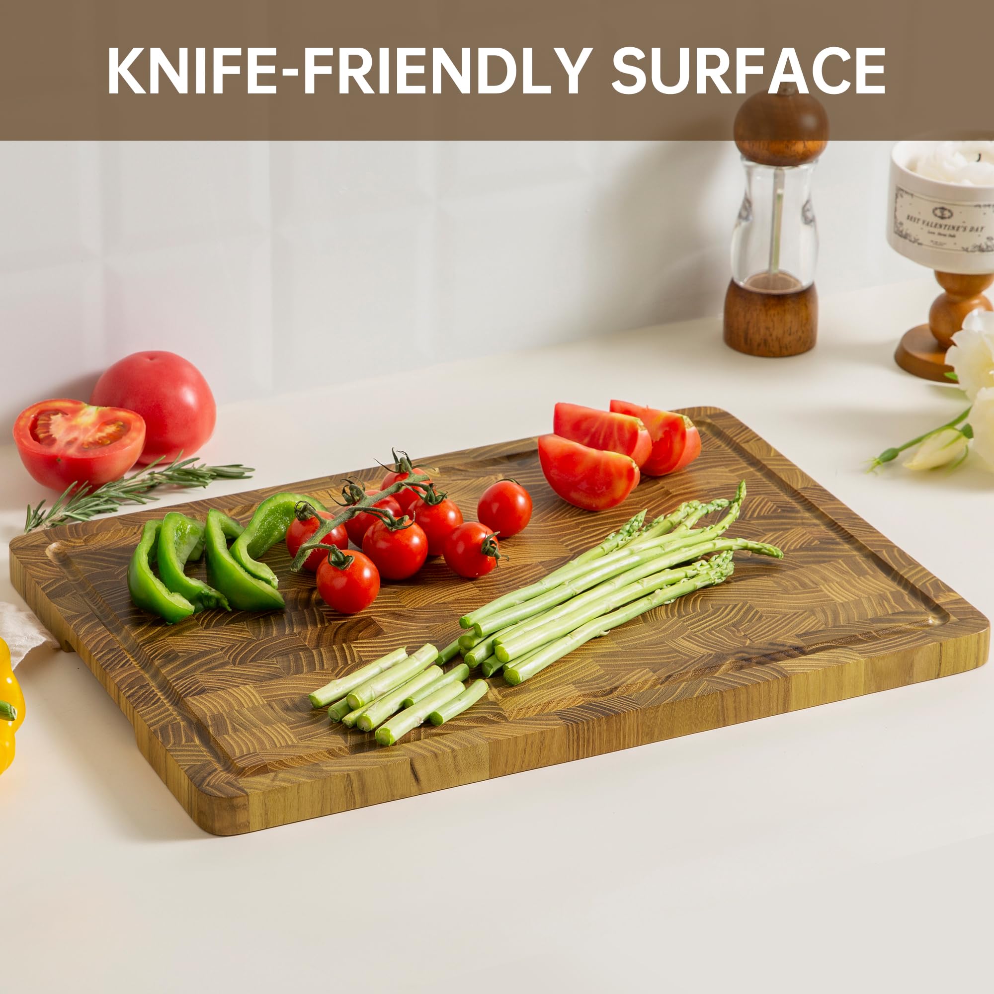 thetchry teak cutting board with built-in handles for easy one-handed transport.