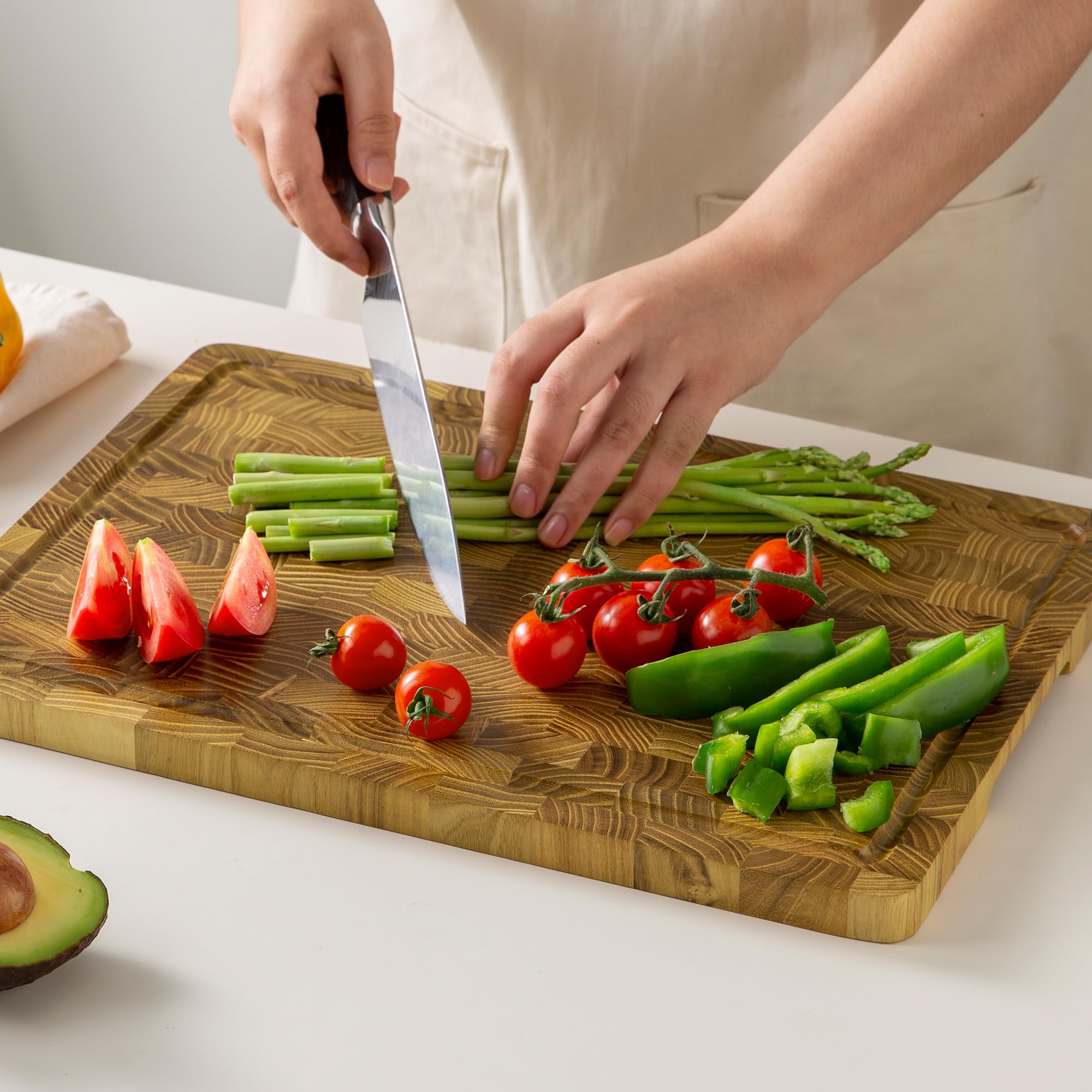 thetchry teak cutting board is easy to clean and keeps counters tidy after meals.