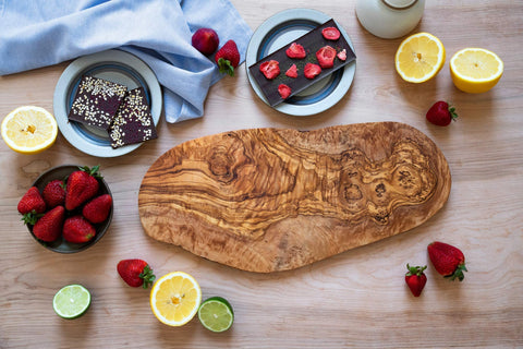 Thirteen Chefs cheese serving tray in olive wood adds warm tones for stylish platters.