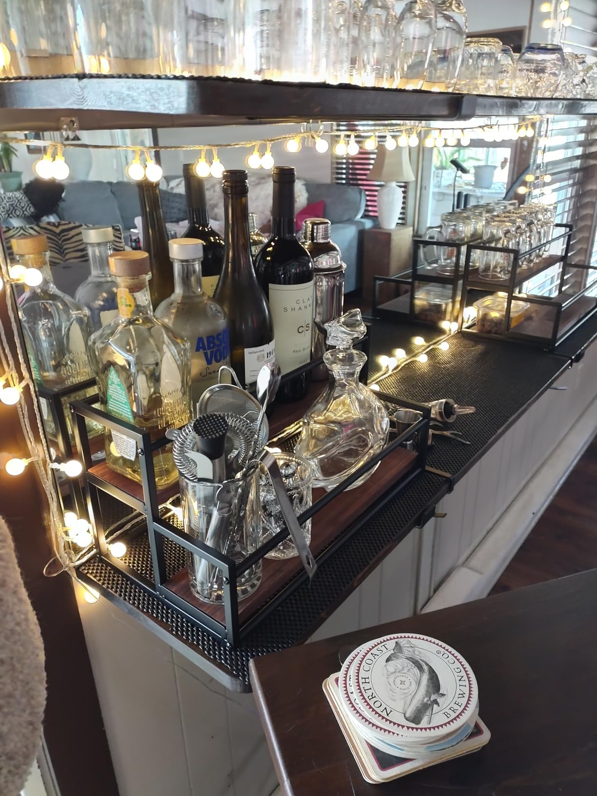 THYGIFTREE coffee bar setup with syrups and spices neatly organized.