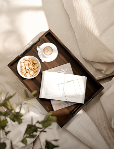 Tidita lightweight wooden tray with black handles; portable between rooms.