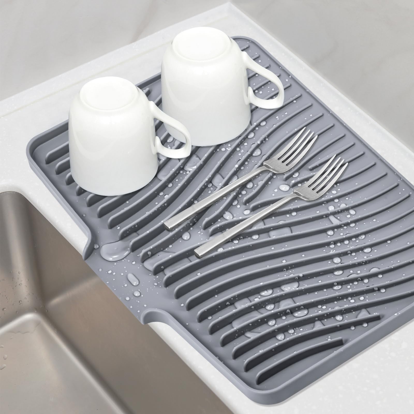 TIKNIK silicone dish drying mat on counter with built-in drain for mess-free drying.