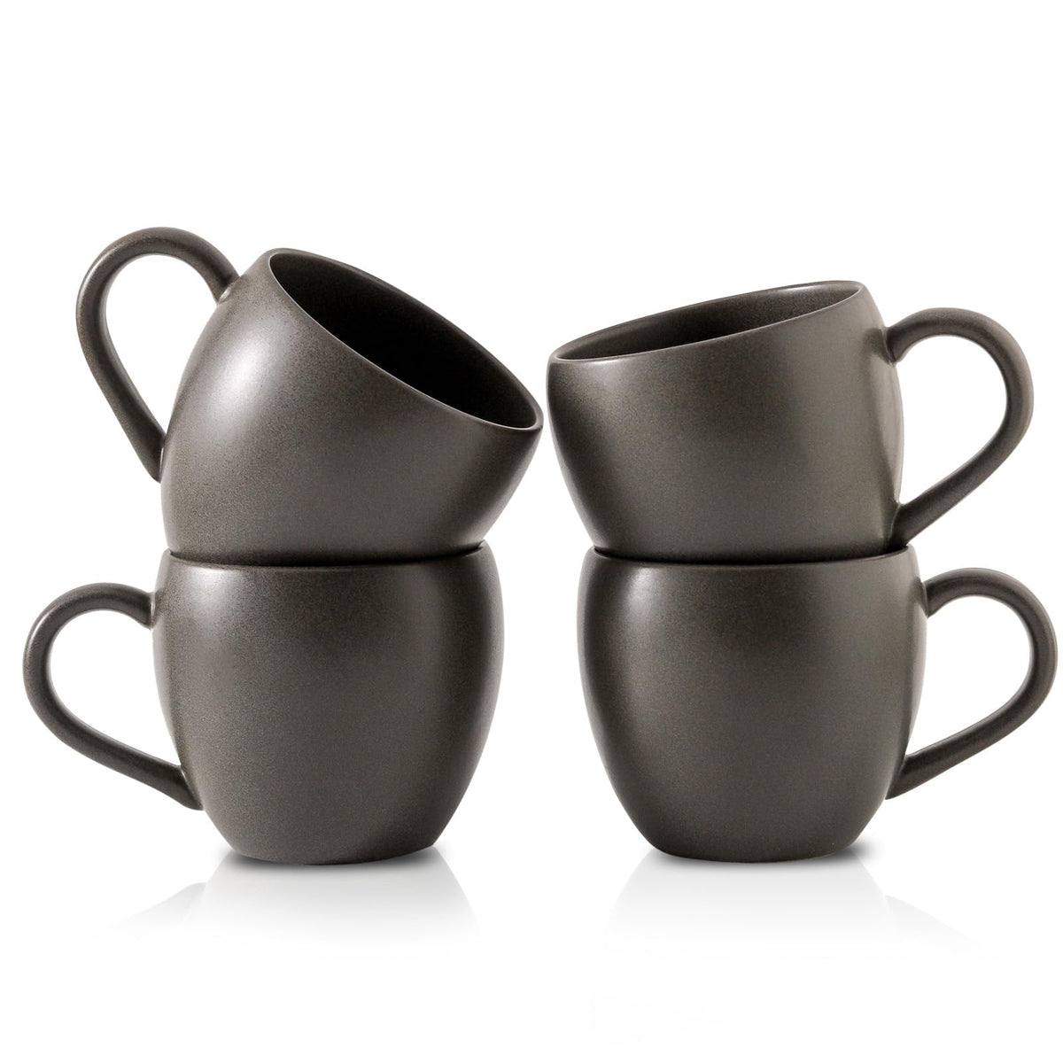 Tikooere coffee mug with black glaze and speckles, ideal for morning coffee rituals.