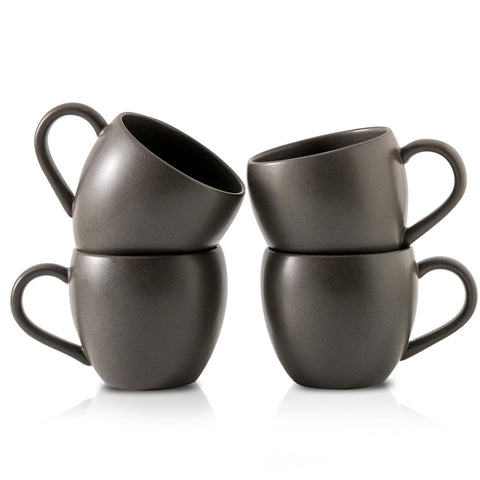 Tikooere coffee mug with black glaze and speckles, ideal for morning coffee rituals.