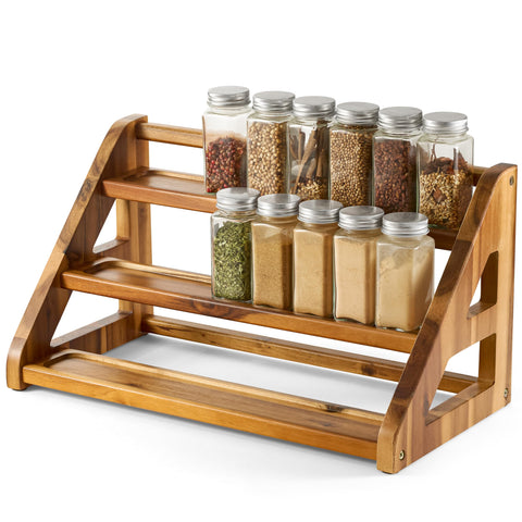 Tinamo acacia wood spice rack on countertop holding 24 jars for easy cooking access.