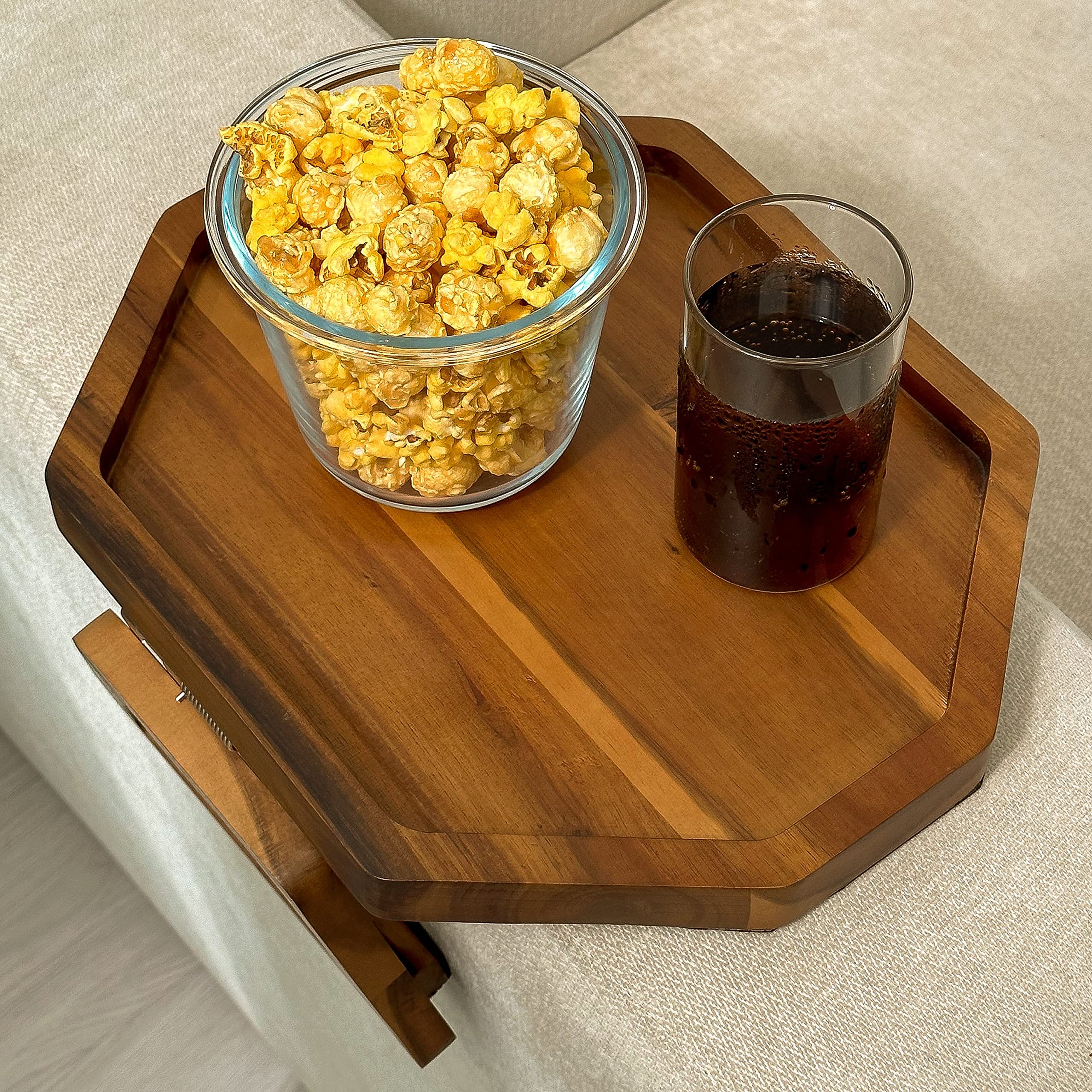 Tinamo collapsible tray folds flat behind sofa for discreet storage.