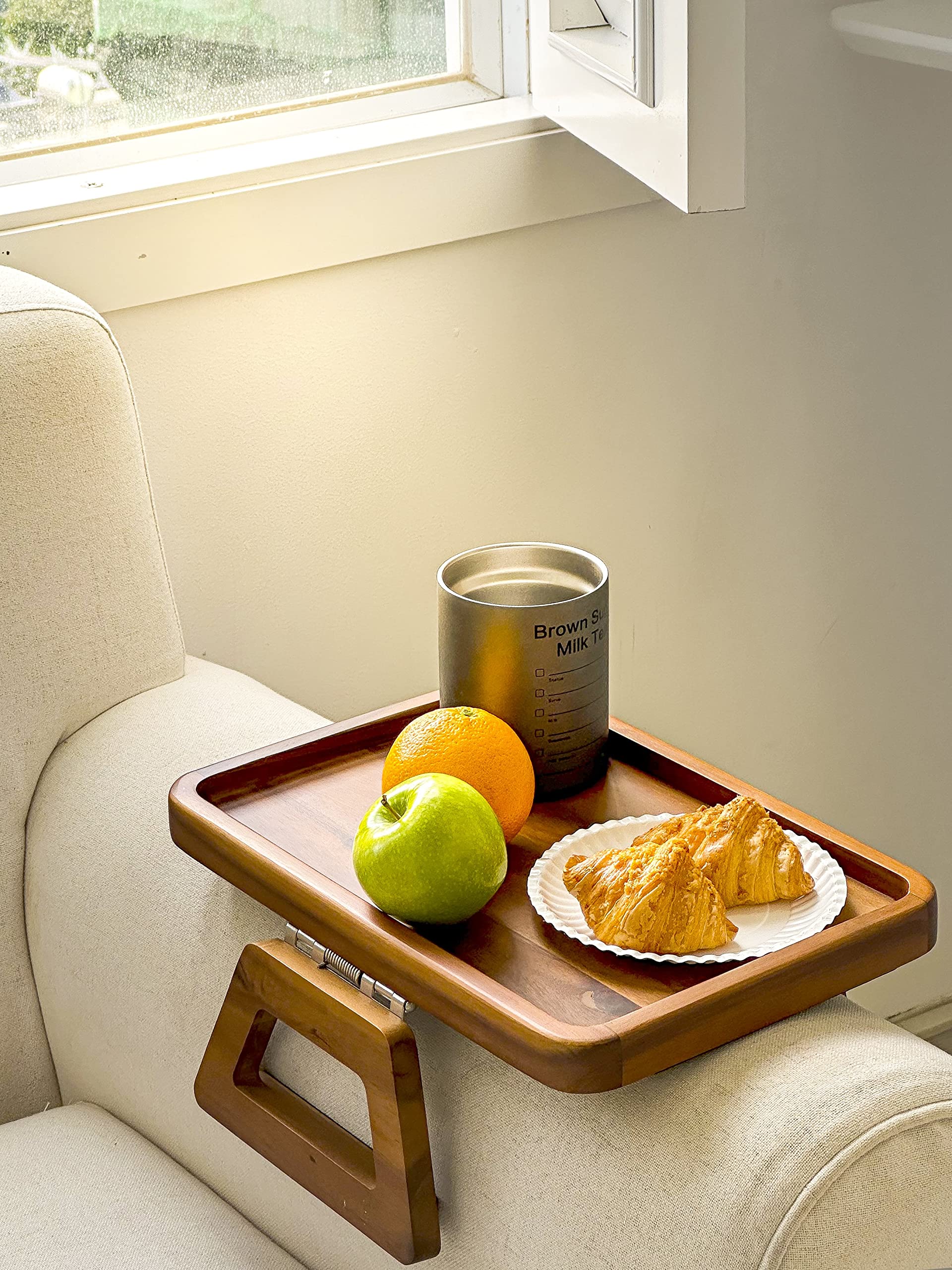 Tinamo compact tray stores neatly behind the sofa when not in use.