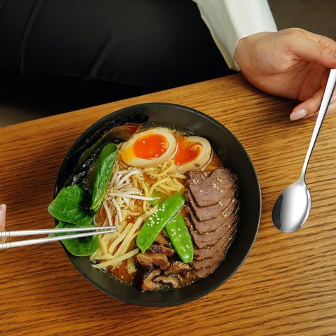 Ergonomic square-handle Tiokin utensils provide stable, comfortable dining.