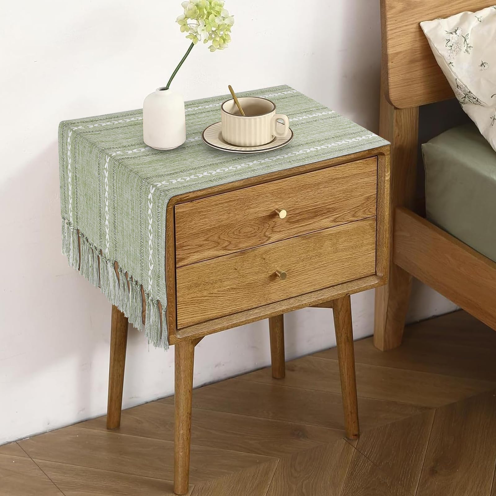 Tiosggd sage green table runner on a dresser adds subtle farmhouse charm