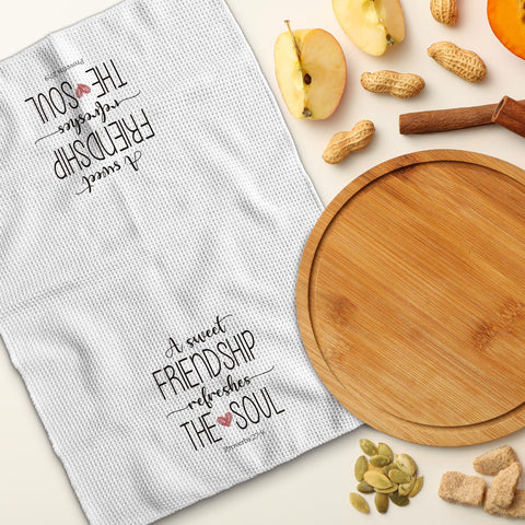 TNUW farmhouse-decor towel displayed on counter.