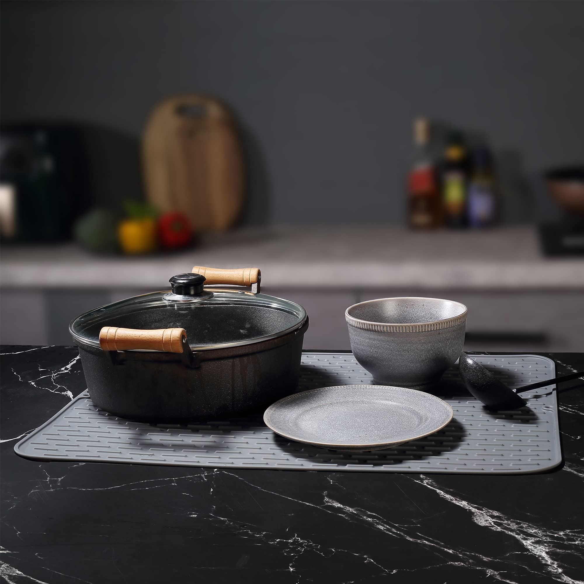 To encounter heat-resistant silicone mat supports hot dishes safely on countertops