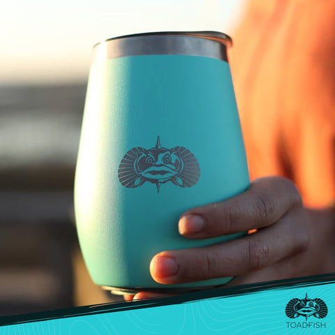 Toadfish boat or golf cart use teal tumbler on the move