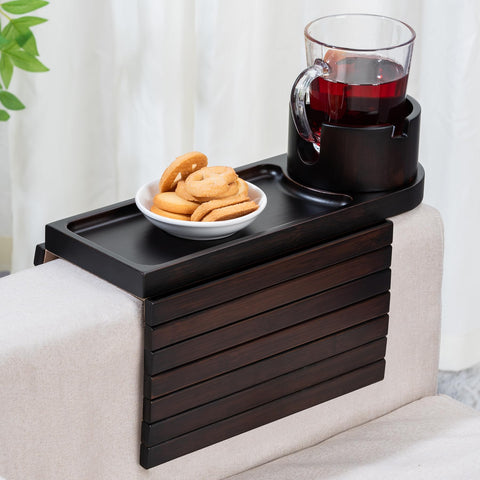 TOMLYOP couch arm tray on a wide walnut armrest with a 360° rotating cup holder for easy reach.