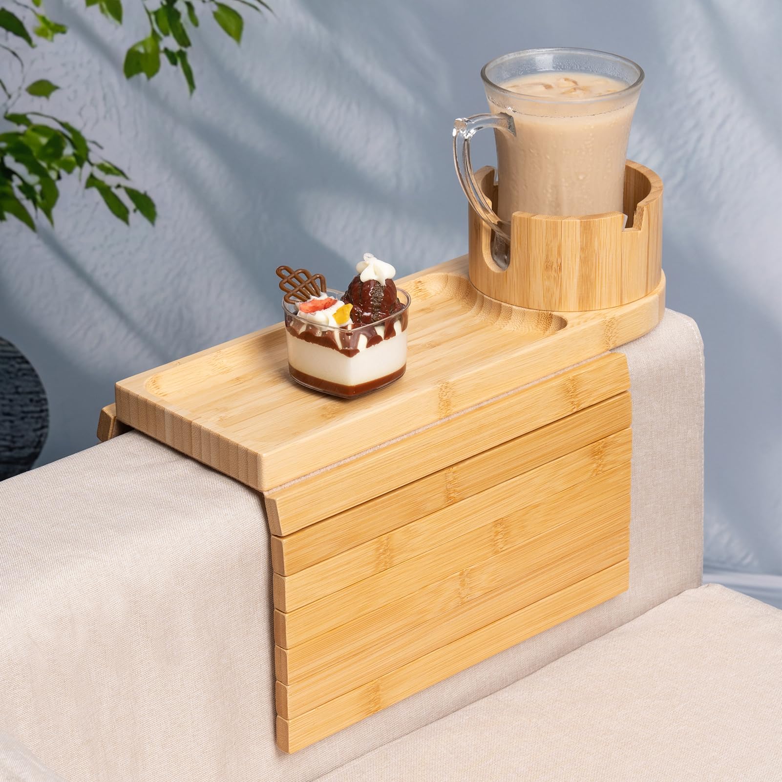 Tomlyop couch arm tray on a wide armrest keeping snacks within reach.