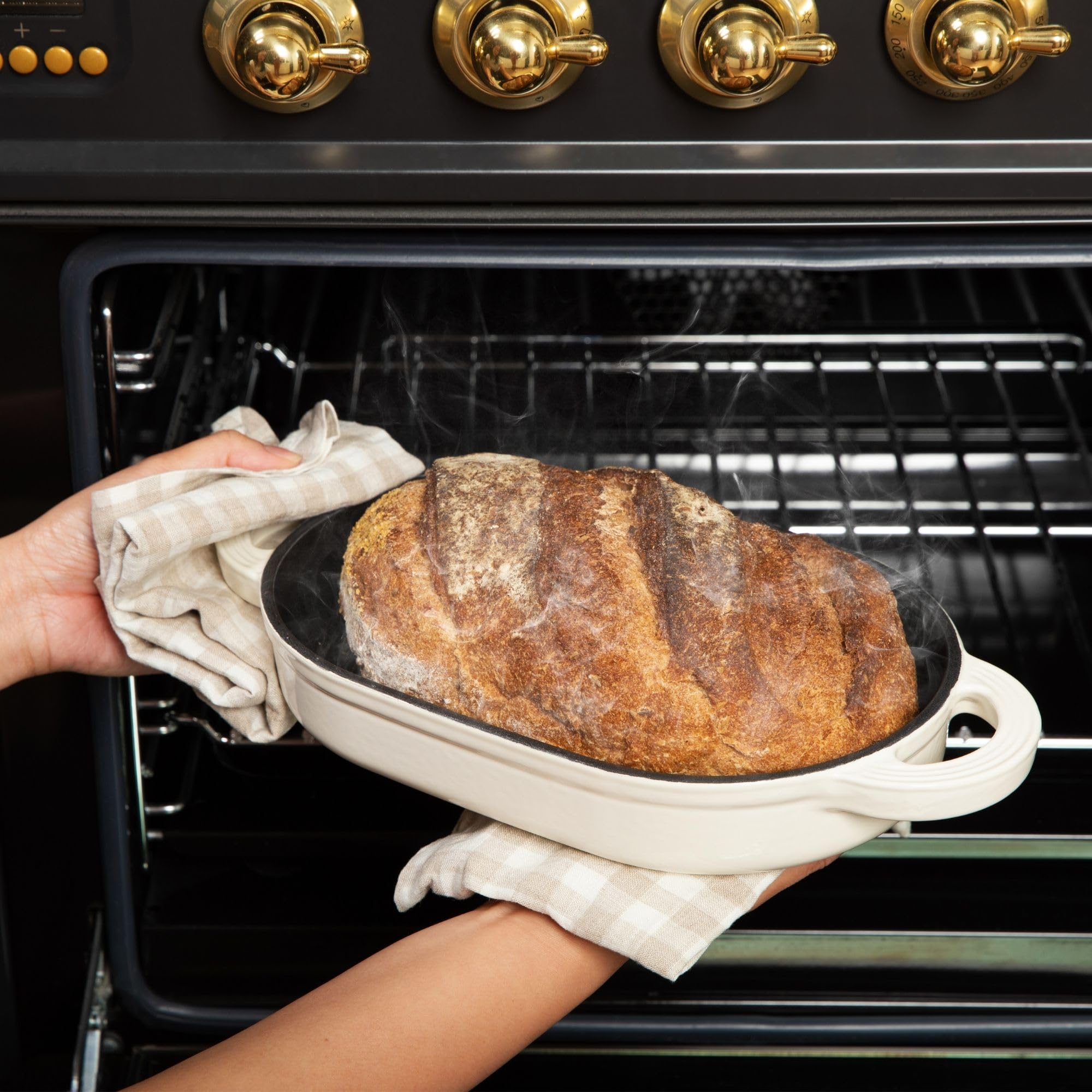 TOMO steam lid in action promotes a golden crust on sourdough loaves