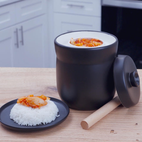 TOMO kit includes weights and wooden tamper for complete setup.
