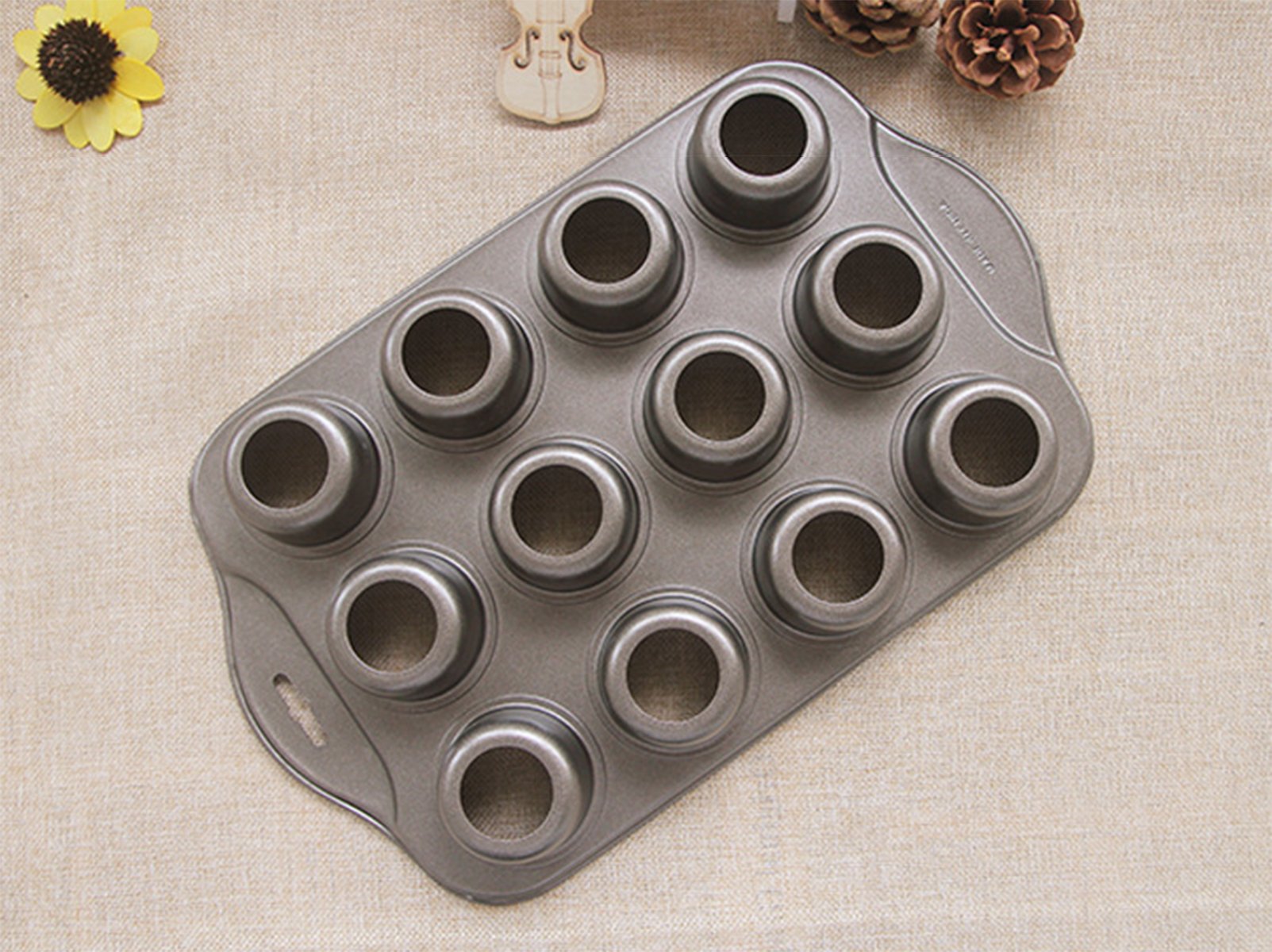 Tosnail versatile pan ideal for muffins, cupcakes, and mini cheesecakes.