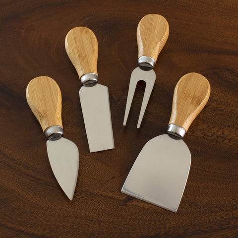 Totally Bamboo charcuterie board accessories set complements fruit, cheese, and meats.