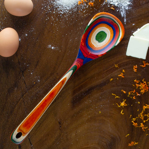 Baltique Marrakesh spoon shows rainbow birch layers for vibrant mixing and serving.