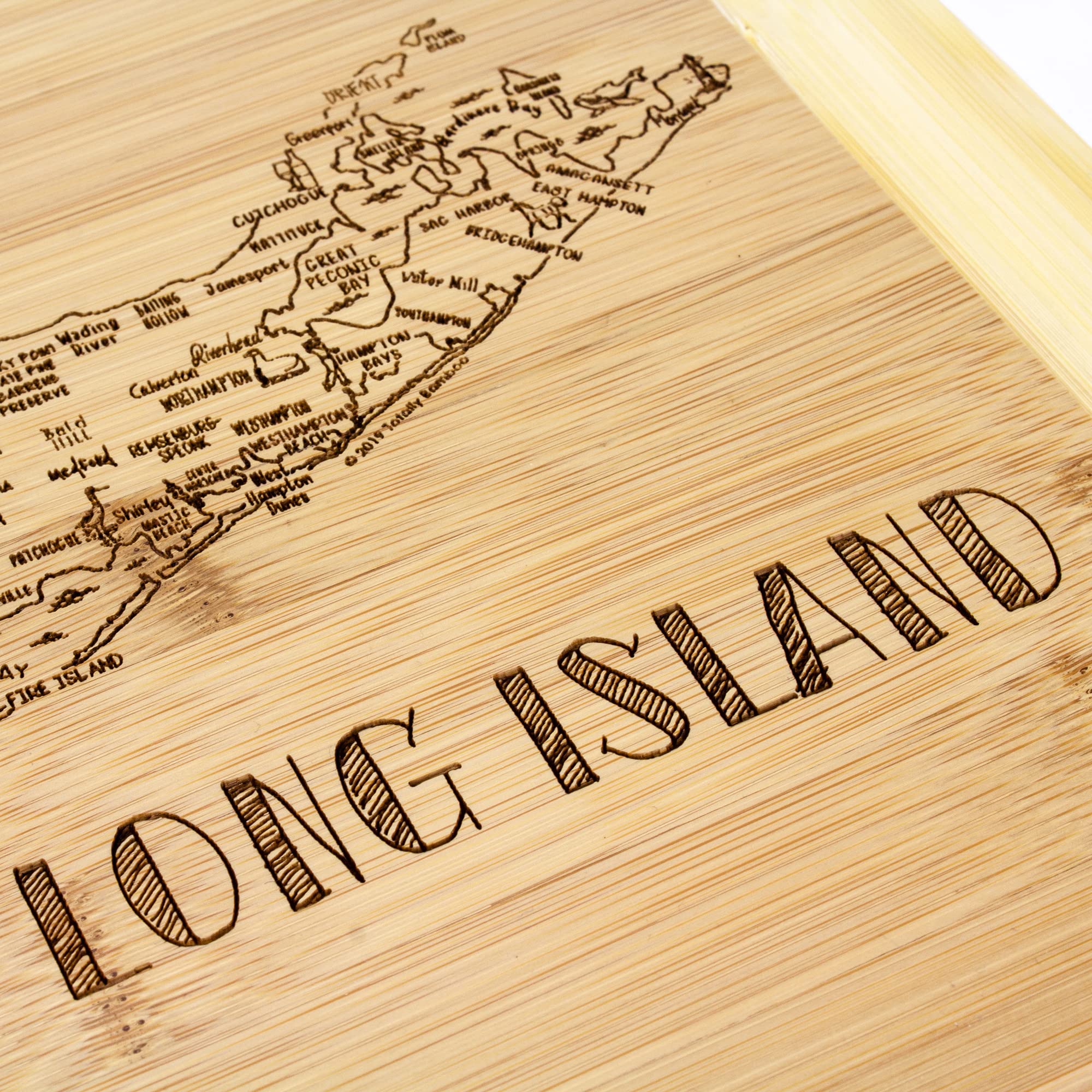 Totally Bamboo dual-sided board offers knife-friendly cutting and stylish serving.